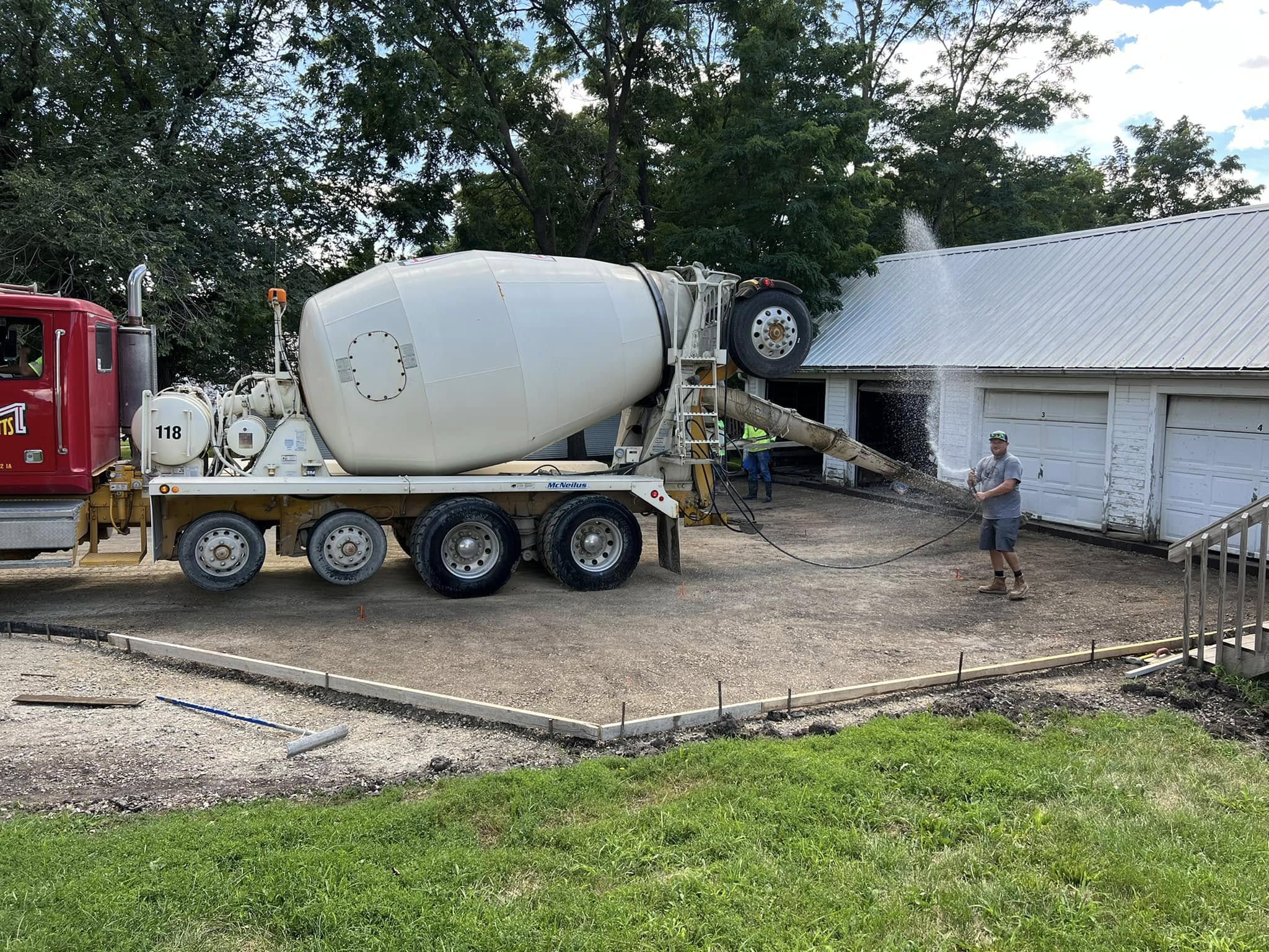 Concrete mixer truck delivering for a residential driveway pour