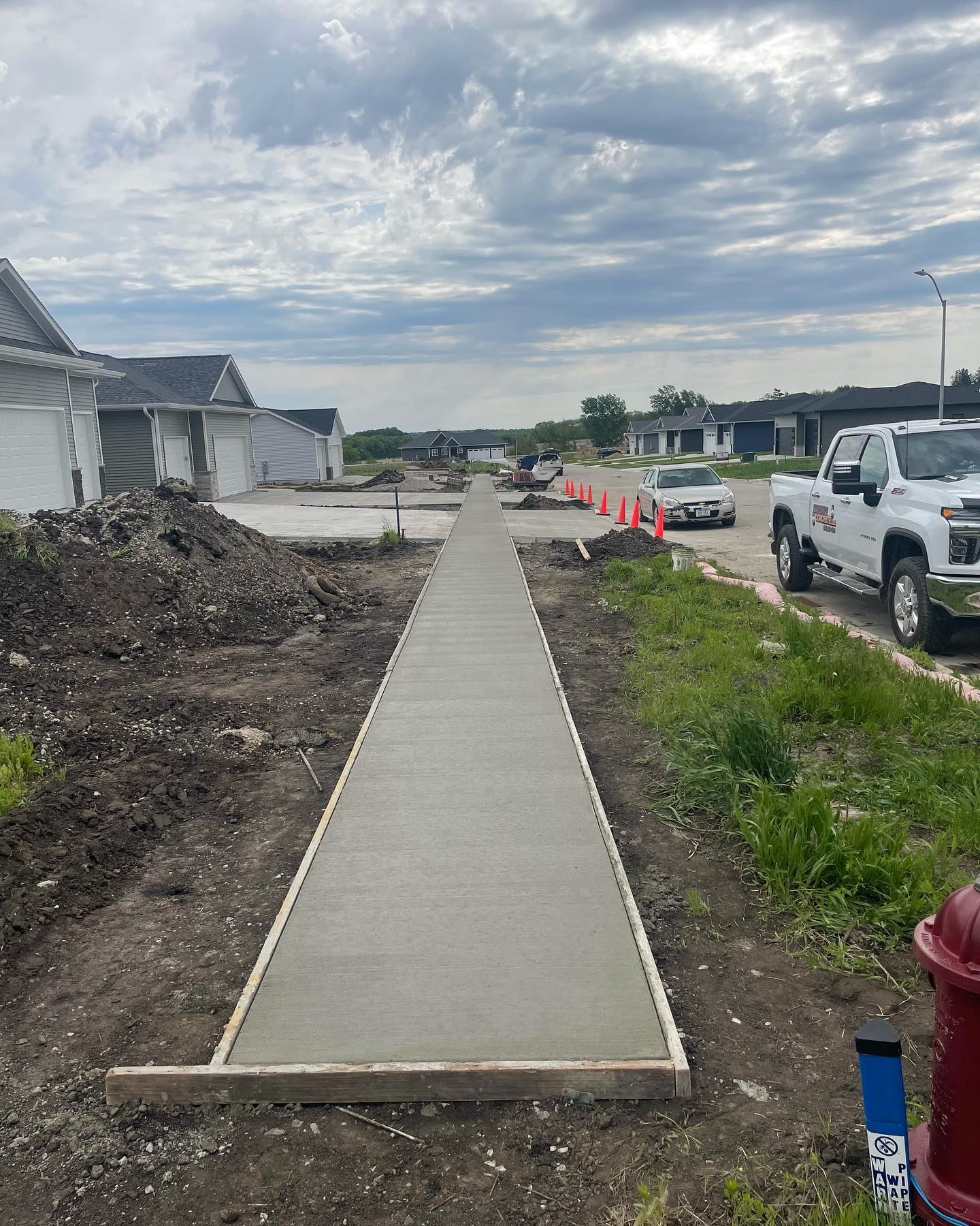 Long concrete sidewalk in a new commercial development